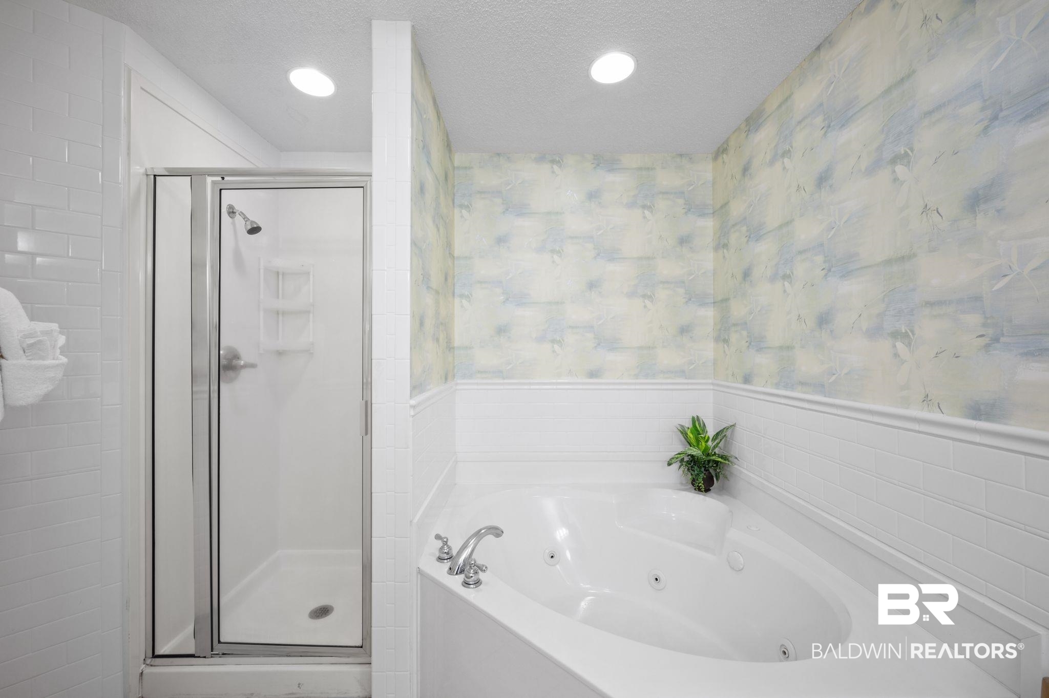 27580 Canal Road, Unit 1427 Orange Beach, AL 36561 - Photo 25 of 38 Bathroom with a whirlpool tub, a stall shower, wallpapered walls, recessed lighting, and a textured ceiling