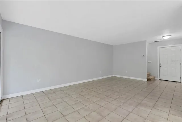an empty room with white walls