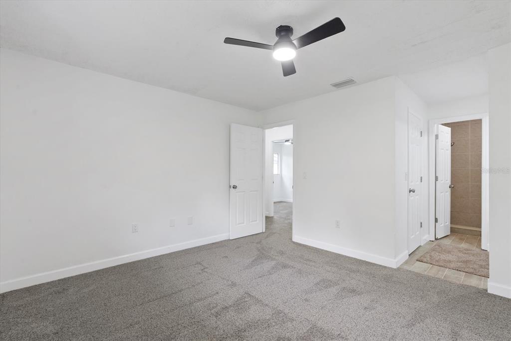 1125 Longfellow Way Sarasota, FL 34243 - Photo 17 of 43 an empty room with ceiling fan