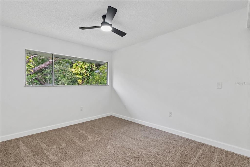1125 Longfellow Way Sarasota, FL 34243 - Photo 23 of 43 an empty room with windows