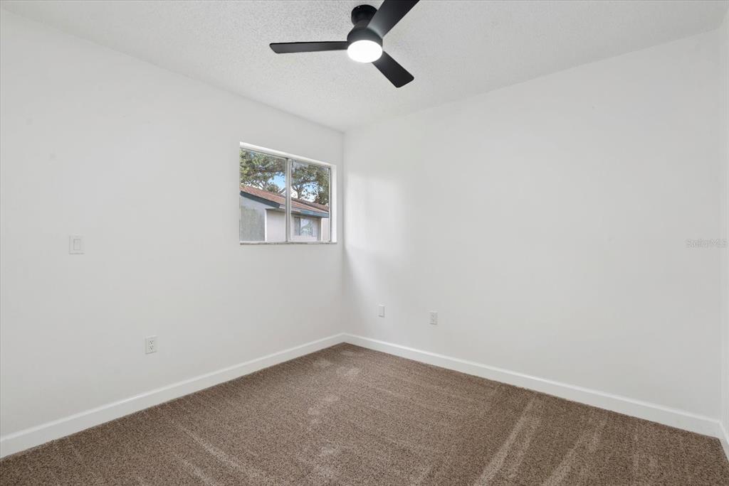 1125 Longfellow Way Sarasota, FL 34243 - Photo 25 of 43 an empty room with windows