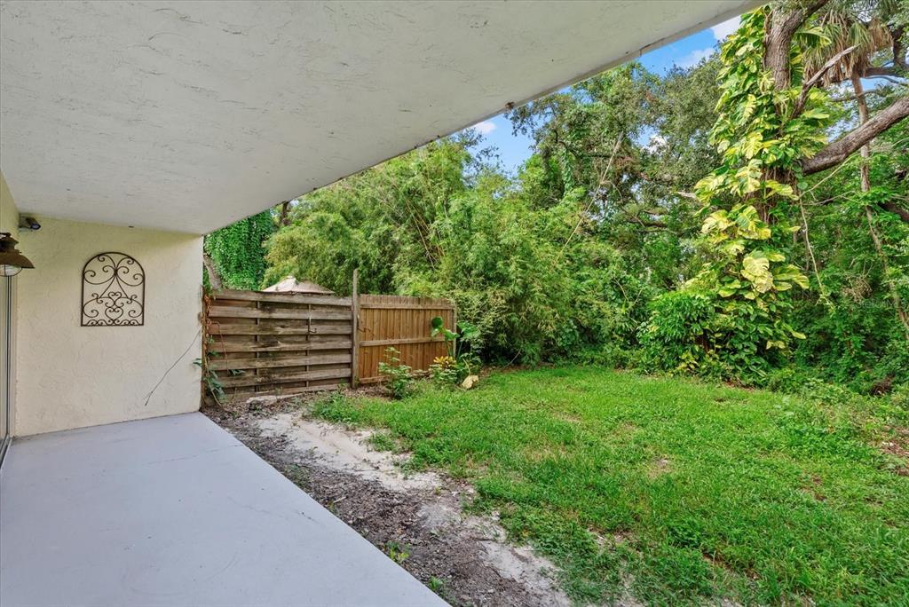 1125 Longfellow Way Sarasota, FL 34243 - Photo 26 of 43 a backyard of a house with lots of green space