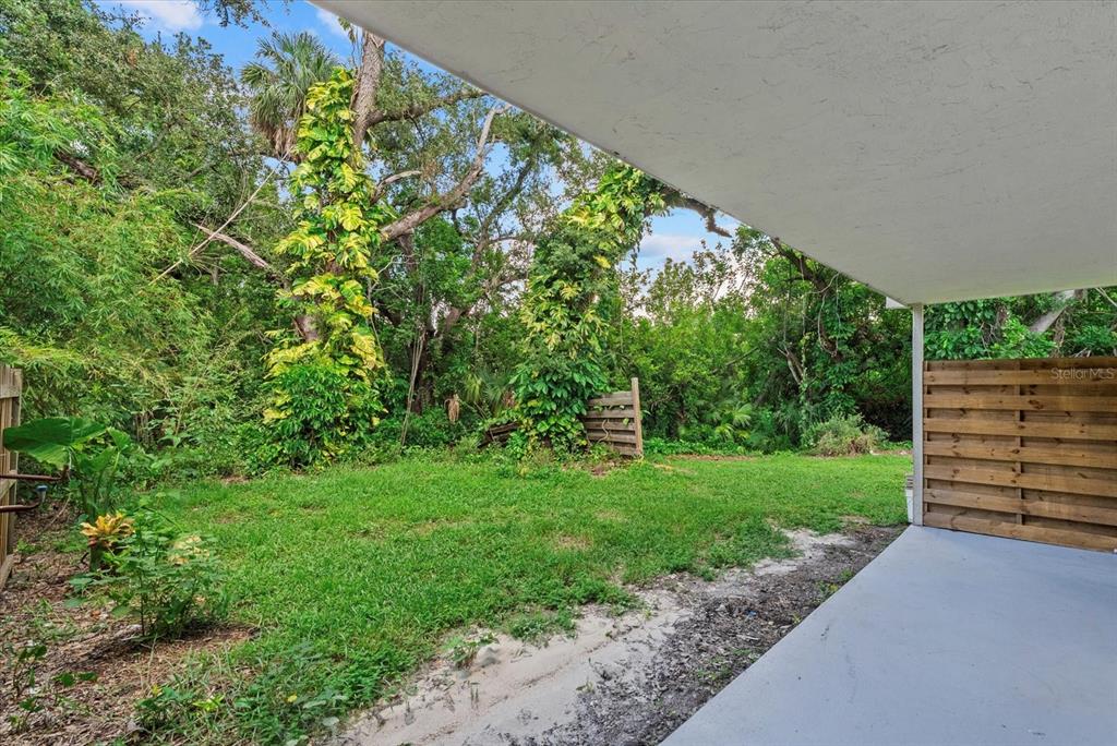 1125 Longfellow Way Sarasota, FL 34243 - Photo 27 of 43 a view of a garden with a wooden fence