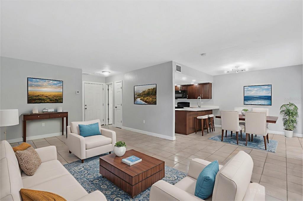 1125 Longfellow Way Sarasota, FL 34243 - Photo 3 of 43 a living room with furniture and a flat screen tv