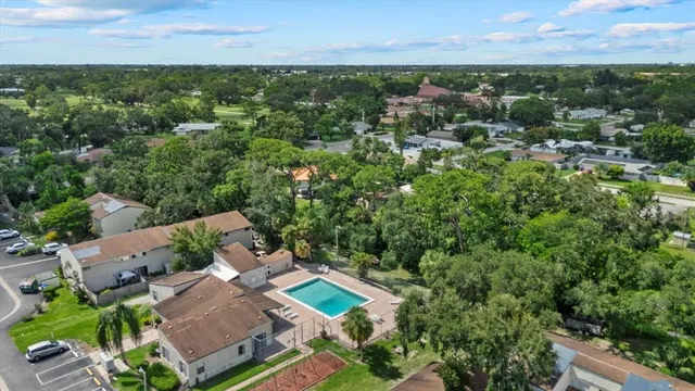an aerial view of a house with a yard and a garage