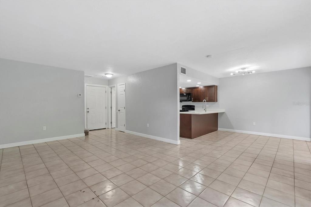 1125 Longfellow Way Sarasota, FL 34243 - Photo 4 of 43 a view of a kitchen with a sink and a microwave