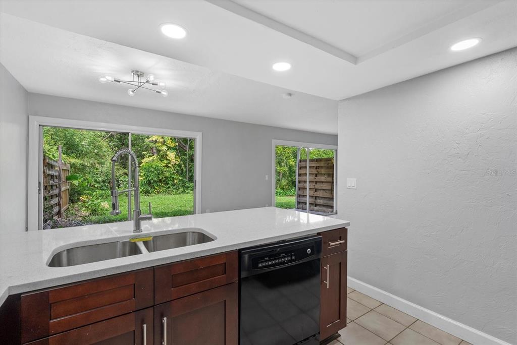 1125 Longfellow Way Sarasota, FL 34243 - Photo 9 of 43 a kitchen with a sink and large window