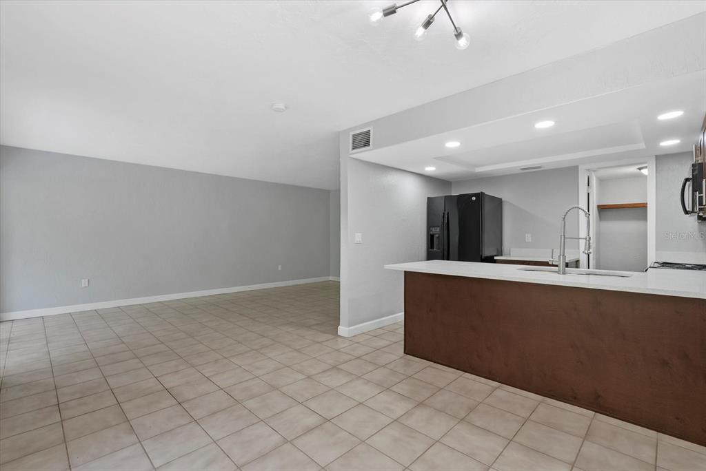 1125 Longfellow Way Sarasota, FL 34243 - Photo 10 of 43 a view of kitchen with stainless steel appliances a refrigerator and a counter top space