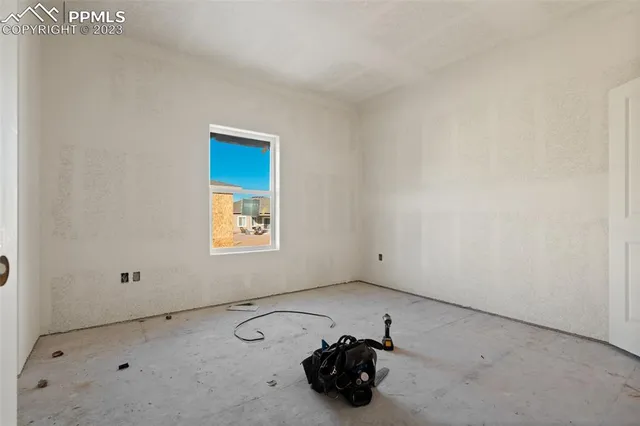 a room with a bed and a window