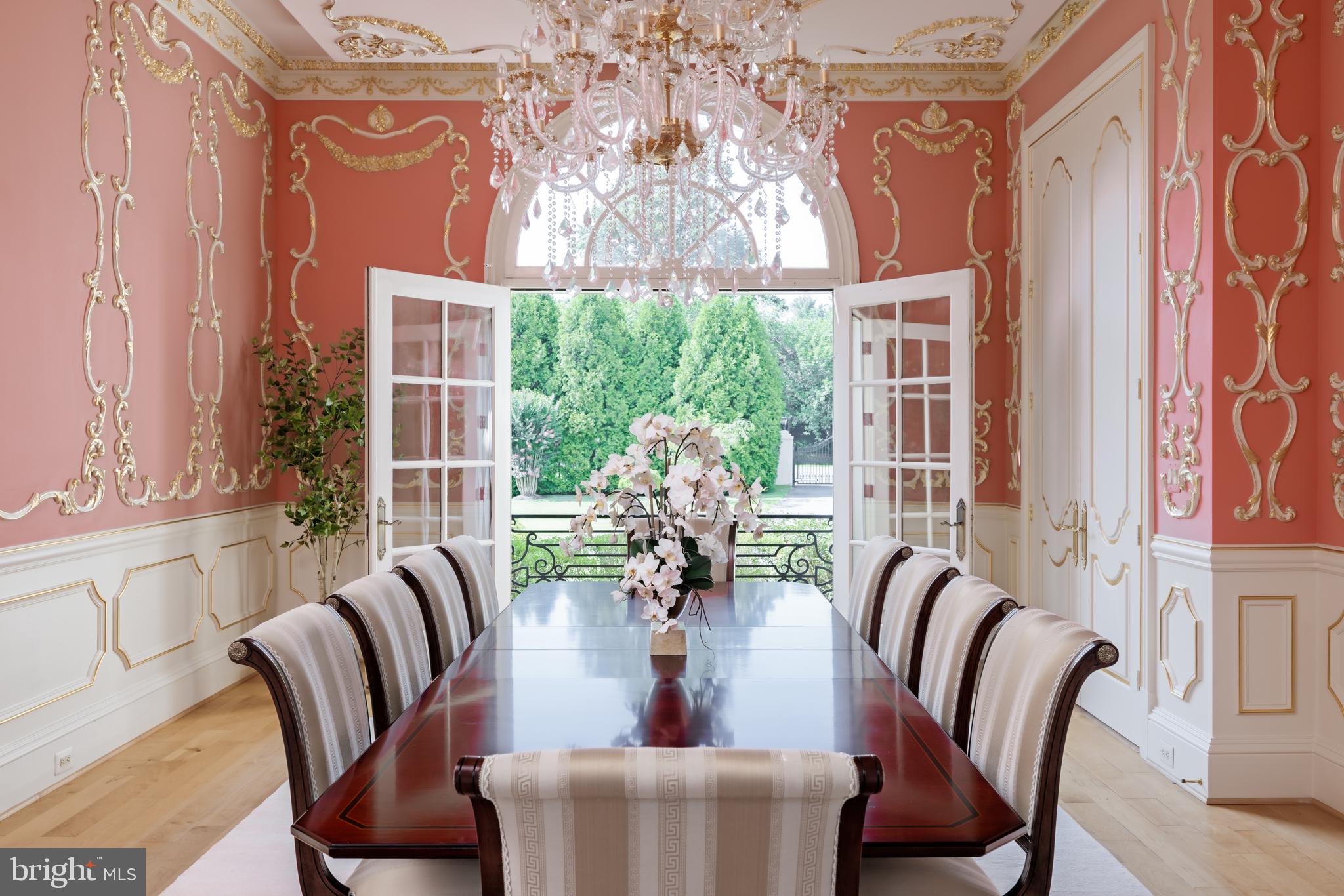 9431 Newbridge Drive Potomac, MD 20854 - Photo 13 of 50 a view of a dining room with furniture a potted plant and a chandelier