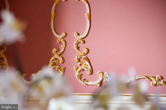 a living room with fireplace furniture and a large window
