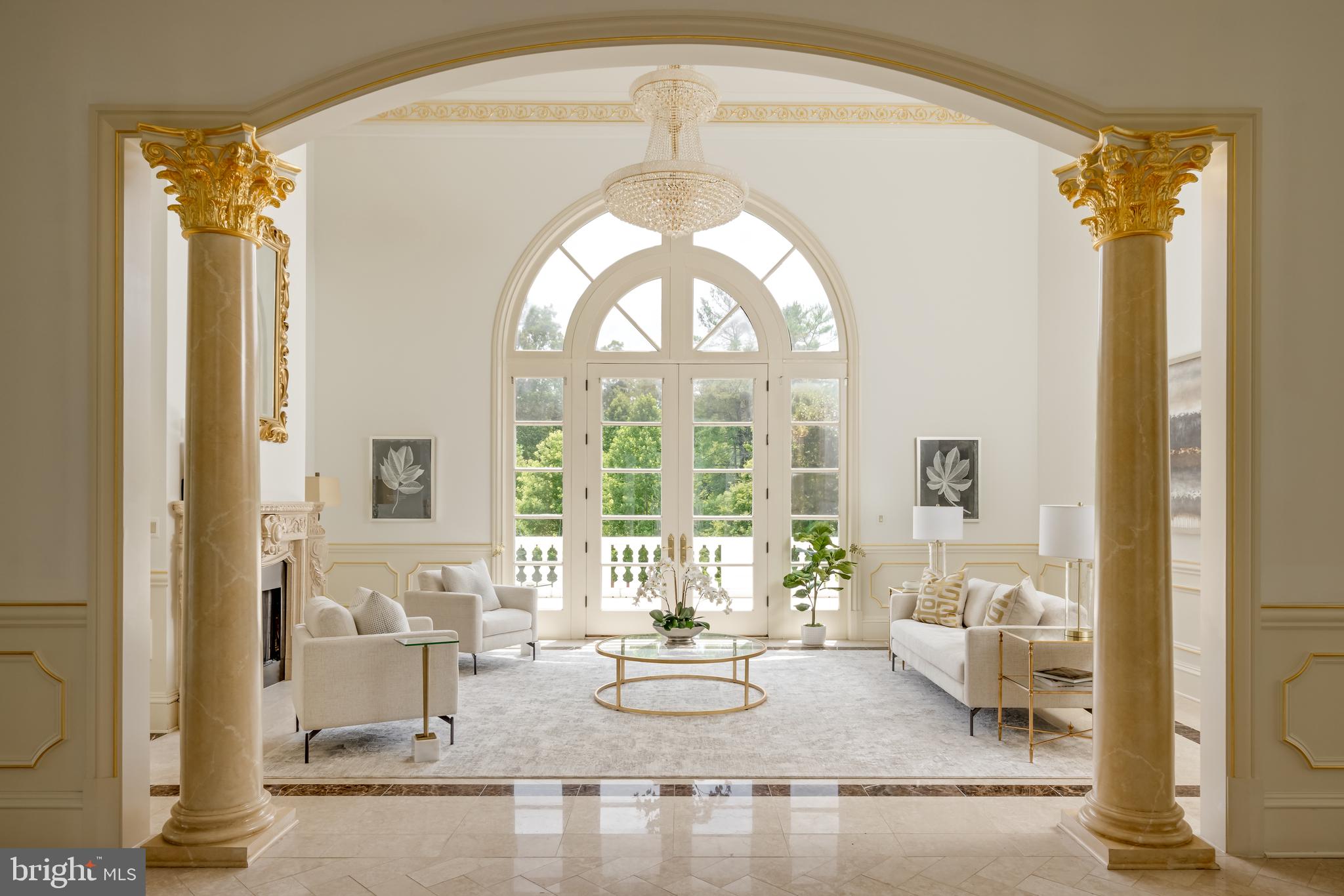 9431 Newbridge Drive Potomac, MD 20854 - Photo 15 of 50 a living room with fireplace furniture and a large window