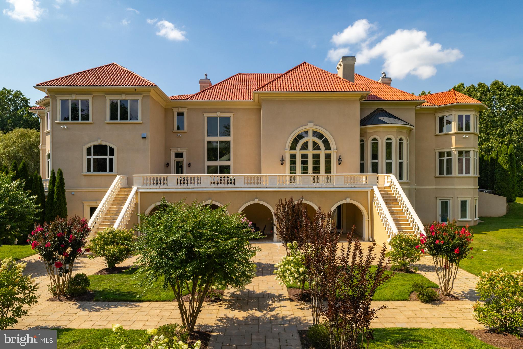 9431 Newbridge Drive Potomac, MD 20854 - Photo 18 of 50 a front view of a house with a yard