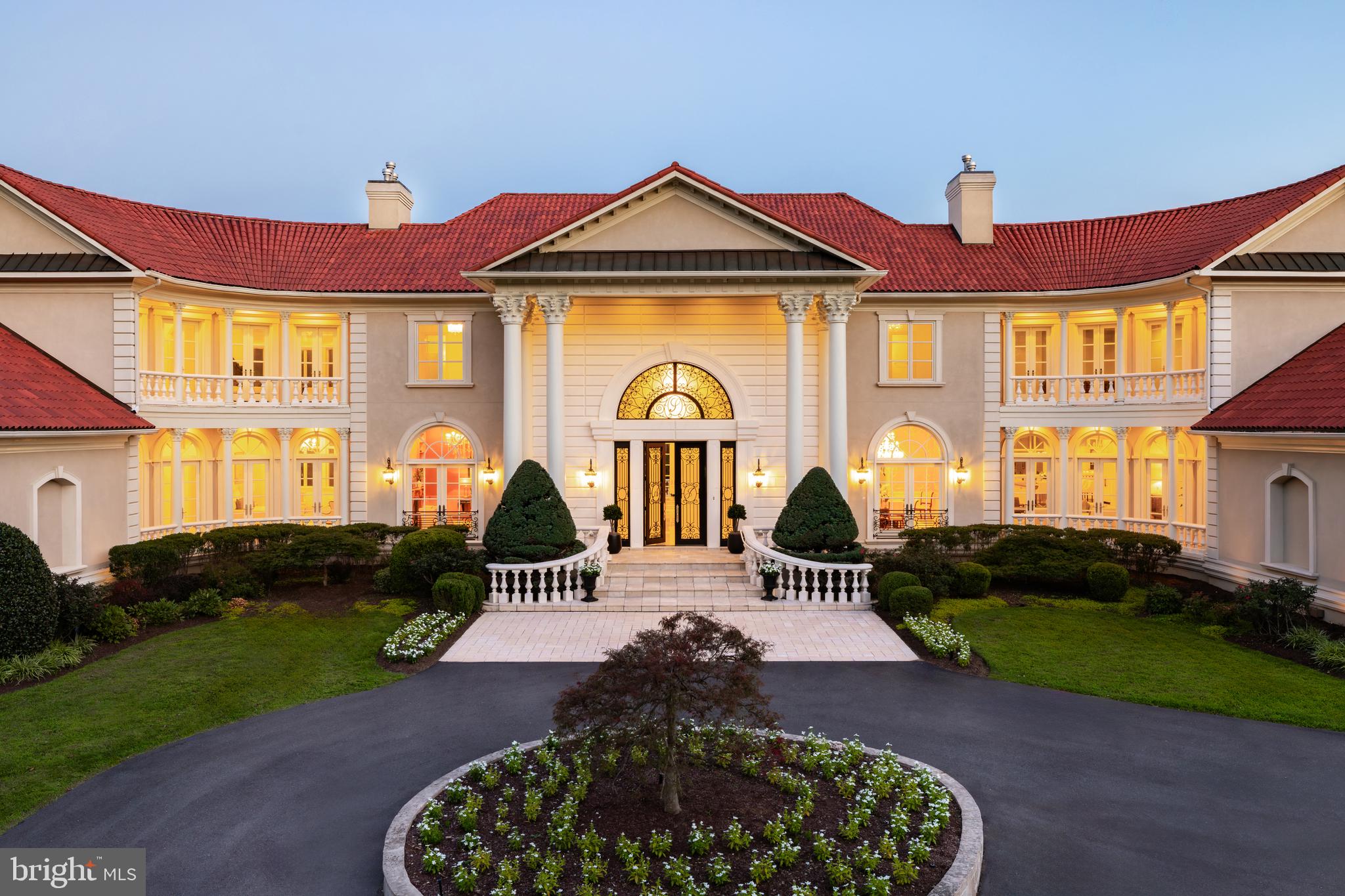 9431 Newbridge Drive Potomac, MD 20854 - Photo 2 of 50 a front view of a house with garden