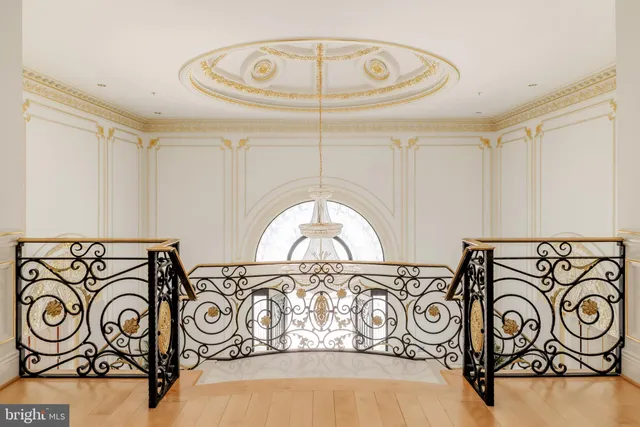 a bedroom with a bed mirror and window