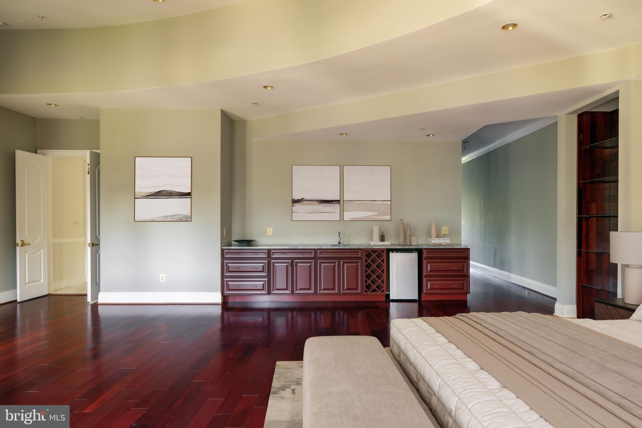 9431 Newbridge Drive Potomac, MD 20854 - Photo 37 of 50 a bedroom with furniture and wooden floor