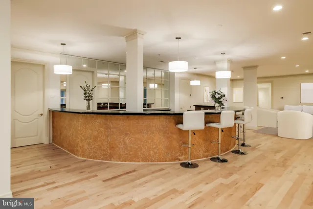 a view of kitchen with stainless steel appliances granite countertop refrigerator sink and stove