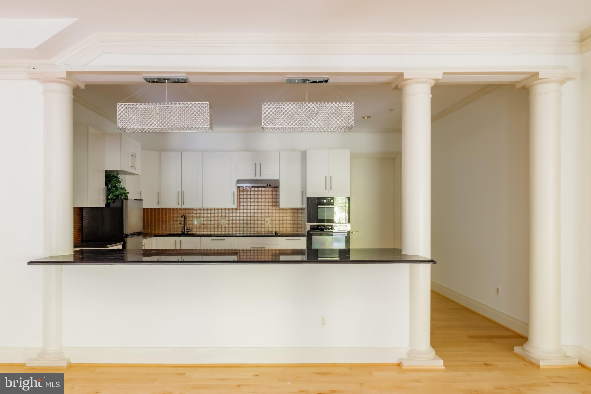 9431 Newbridge Drive Potomac, MD 20854 - Photo 42 of 50 a view of kitchen with stainless steel appliances granite countertop refrigerator sink and stove