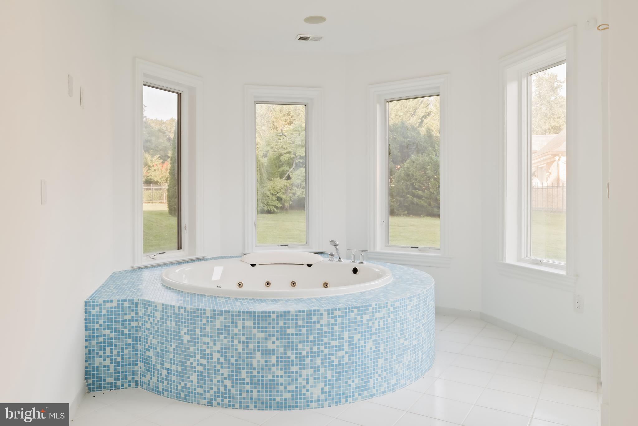 9431 Newbridge Drive Potomac, MD 20854 - Photo 43 of 50 a view of a bath tub sitting in a bathroom