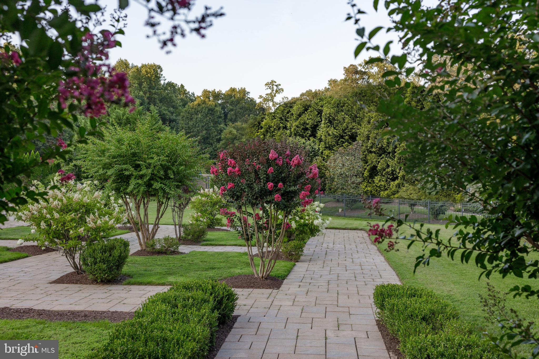 9431 Newbridge Drive Potomac, MD 20854 - Photo 45 of 50 a view of a pathway covered with flower plants