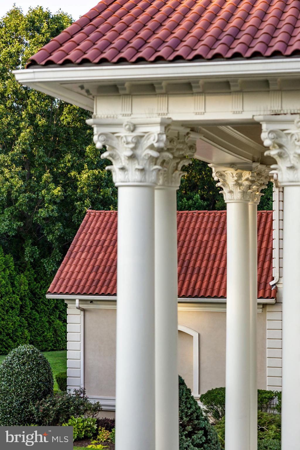 9431 Newbridge Drive Potomac, MD 20854 - Photo 46 of 50 a front view of a house with a garden and plants