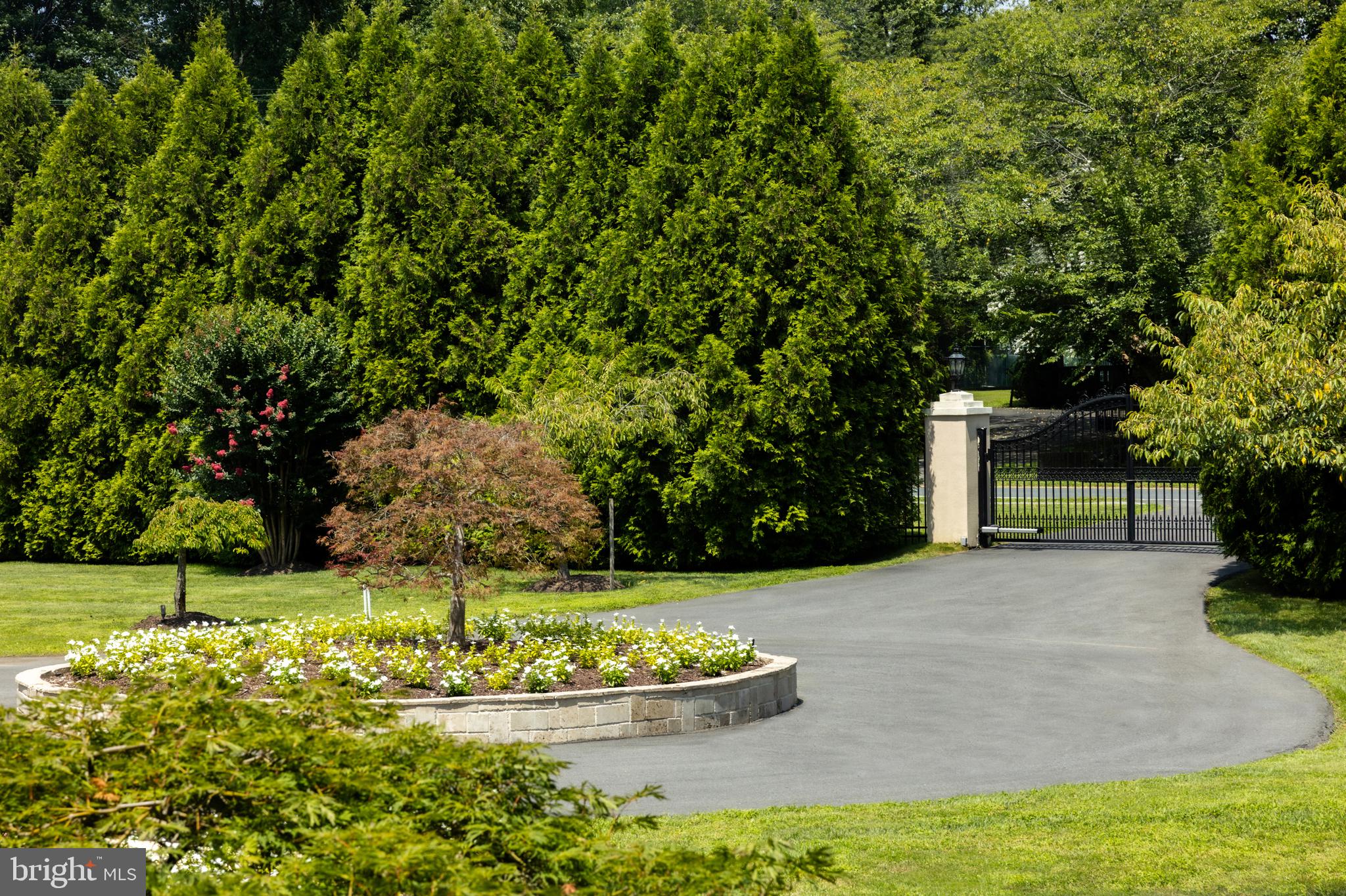 9431 Newbridge Drive Potomac, MD 20854 - Photo 47 of 50 a view of a house with a yard
