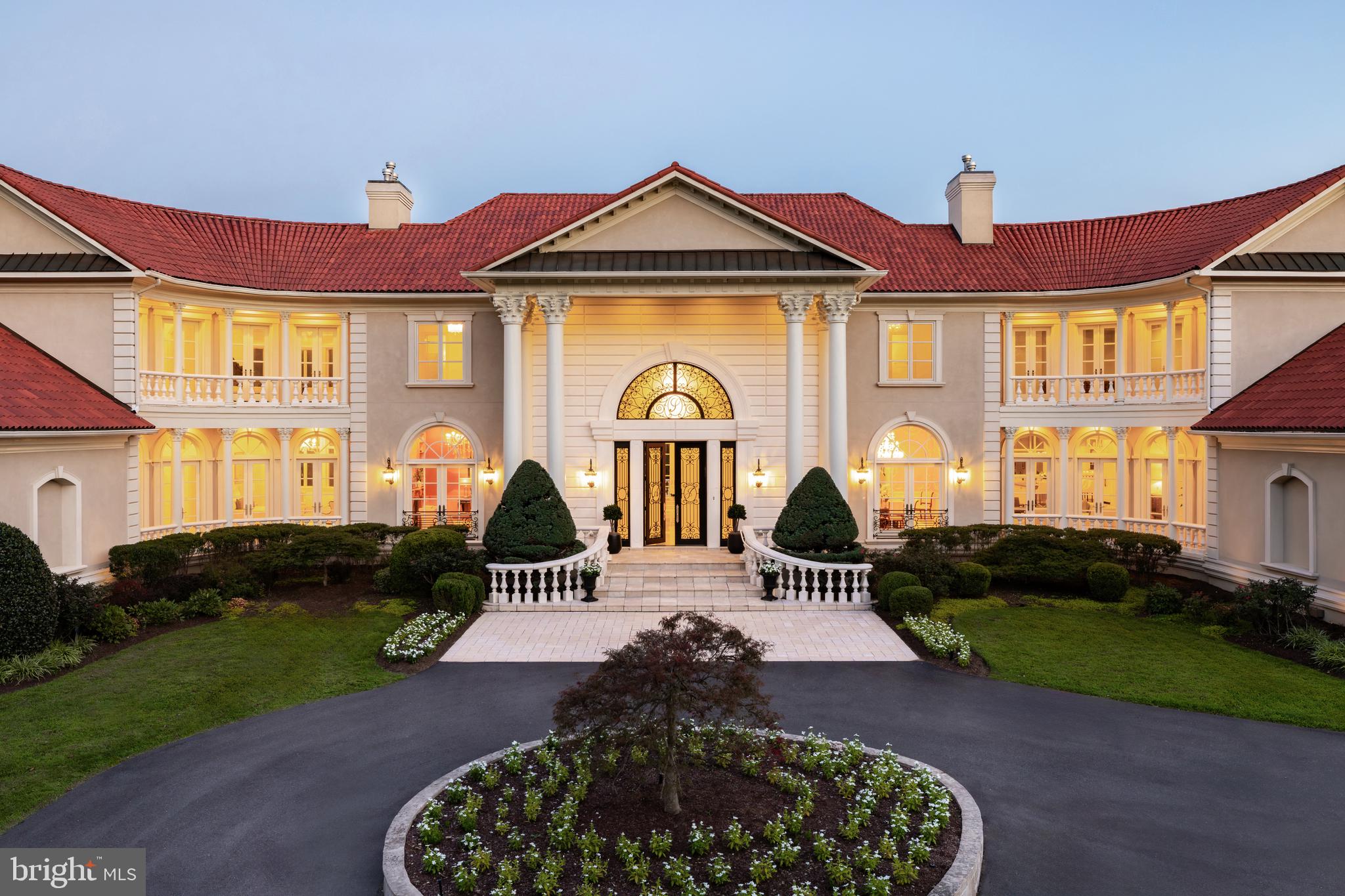 9431 Newbridge Drive Potomac, MD 20854 - Photo 48 of 50 a front view of a house with garden