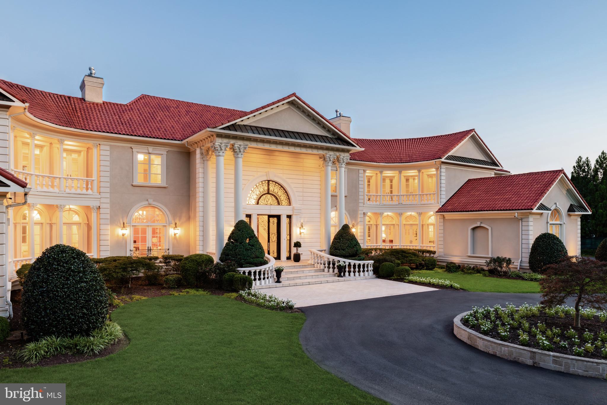 9431 Newbridge Drive Potomac, MD 20854 - Photo 49 of 50 a front view of a house with garden