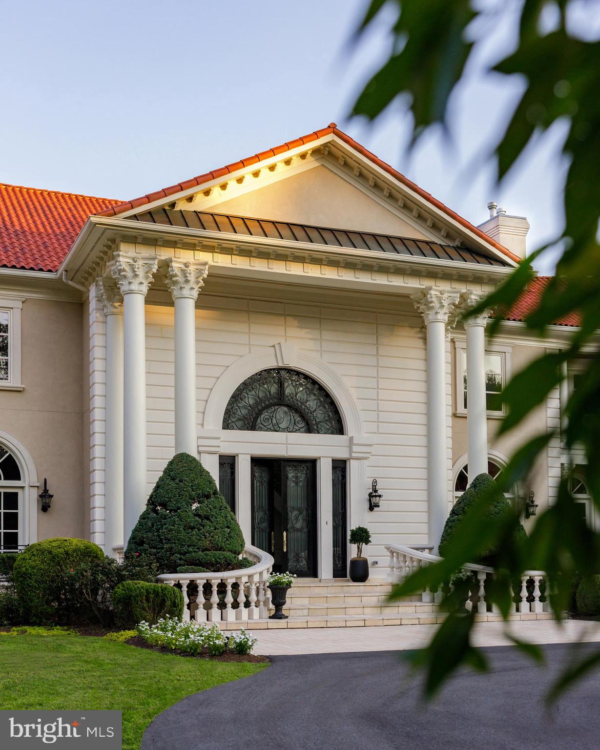 9431 Newbridge Drive Potomac, MD 20854 - Photo 5 of 50 a front view of a house with a yard