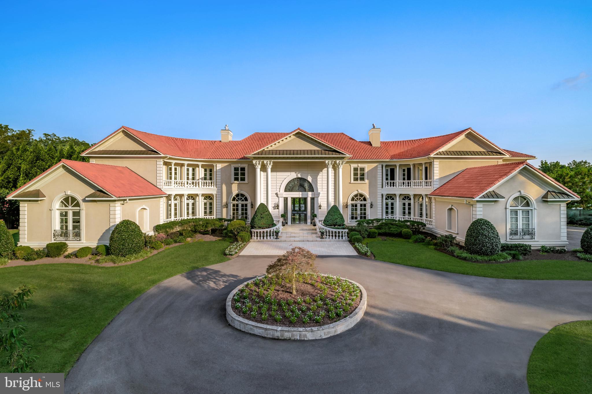 9431 Newbridge Drive Potomac, MD 20854 - Photo 6 of 50 a front view of a house with a yard