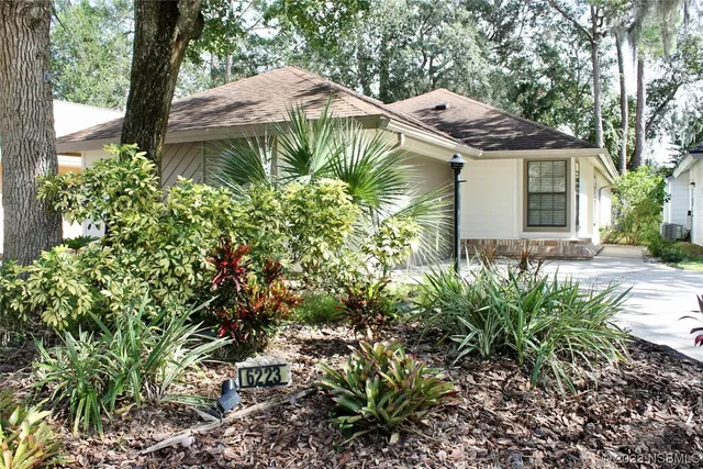a backyard of a house with lots of green space