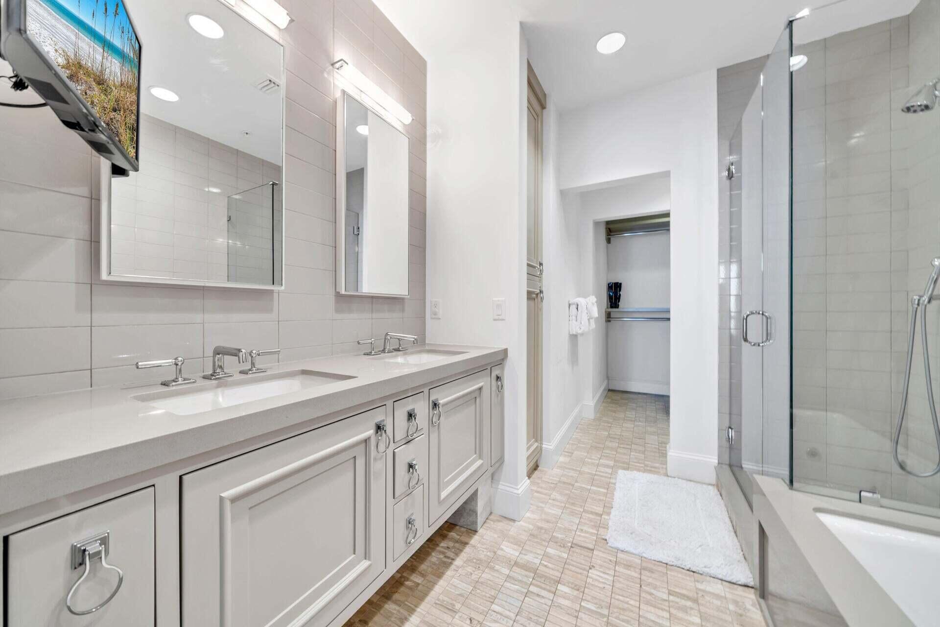 74 Town Hall Road, Unit 3A Rosemary Beach, FL 32461 - Photo 30 of 56 a spacious bathroom with a mirror sink and shower