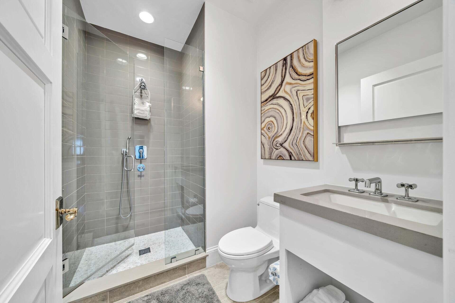 74 Town Hall Road, Unit 3A Rosemary Beach, FL 32461 - Photo 32 of 56 a bathroom with a sink a toilet and shower