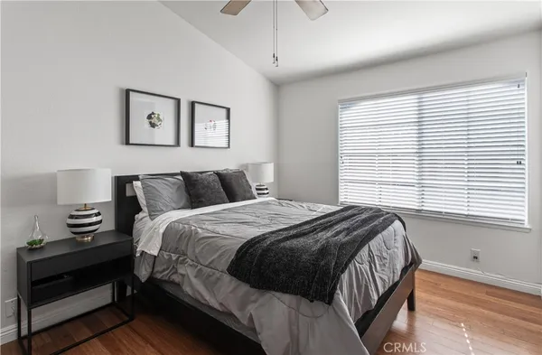 a bedroom with bed and a window