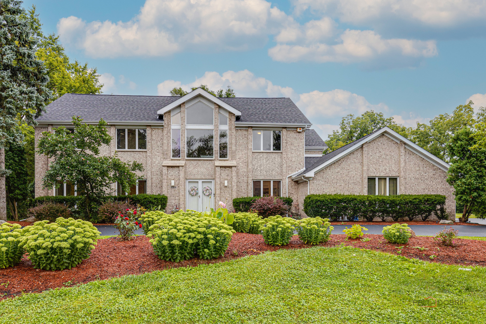 2329 Coach Road Long Grove, IL 60047 - Photo 1 of 56 a front view of a house with a yard