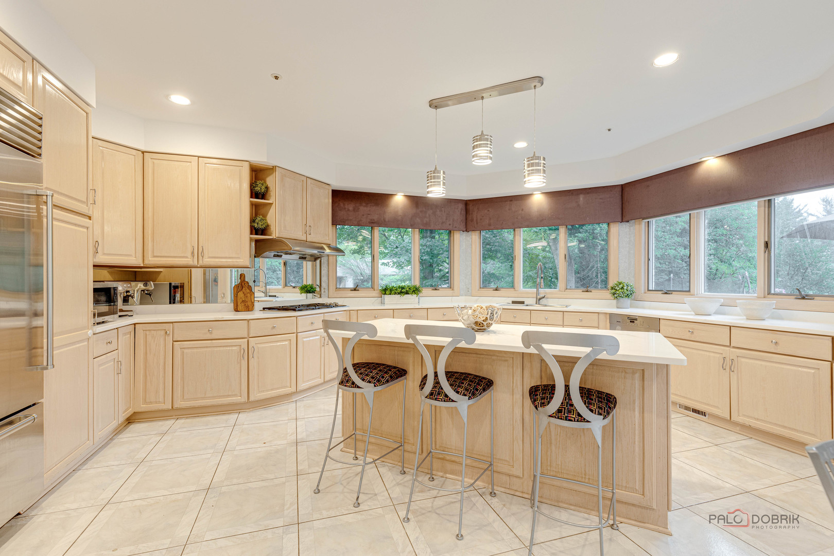 2329 Coach Road Long Grove, IL 60047 - Photo 14 of 56 a kitchen with a sink and white cabinets