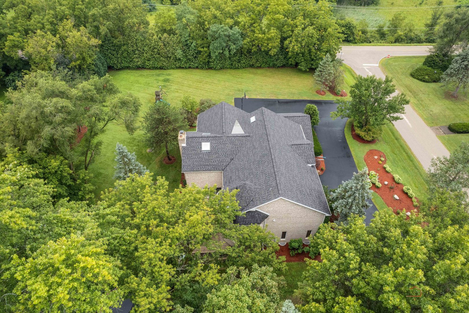 2329 Coach Road Long Grove, IL 60047 - Photo 47 of 56 an aerial view of a house with a yard and lake view