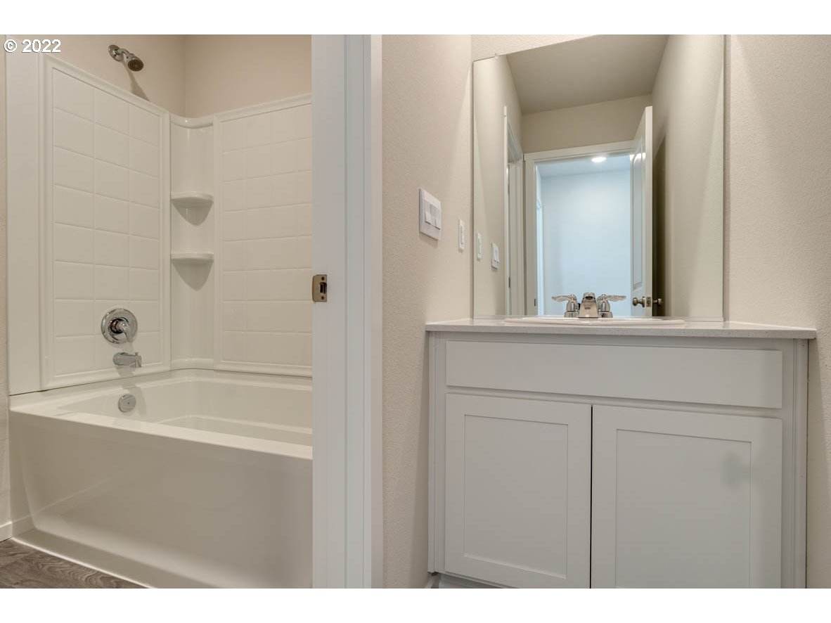 2926 North 3rd Way Ridgefield, WA 98642 - Photo 21 of 26 a bathroom with a bathtub and a sink