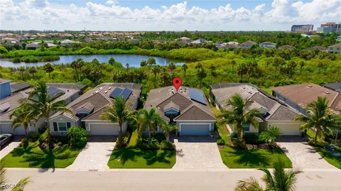 an aerial view of residential house with outdoor space and lake view