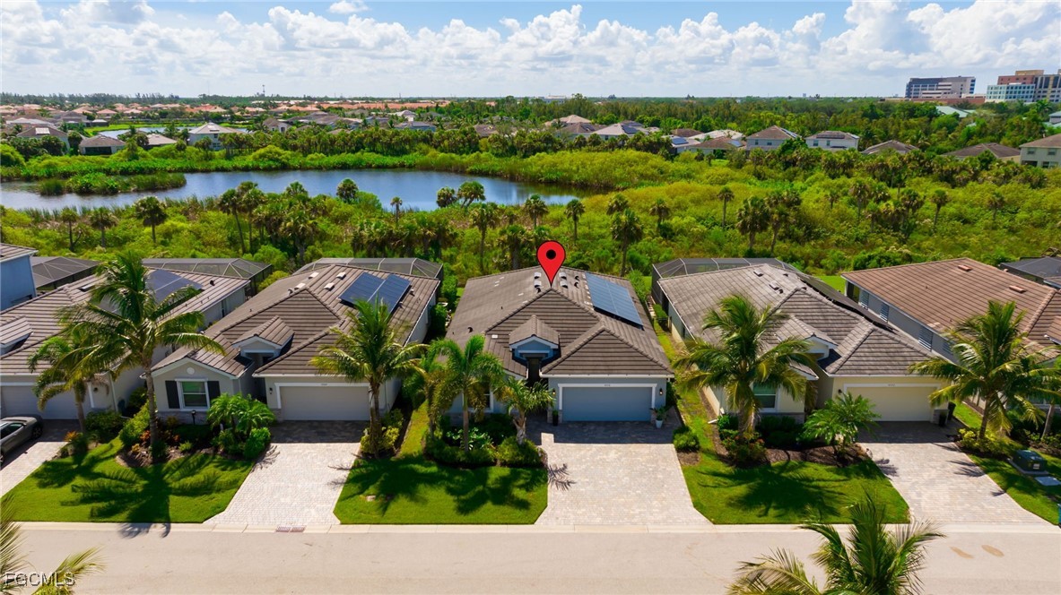 9778 Mirada Boulevard Fort Myers, FL 33908 - Photo 1 of 29 an aerial view of residential house with outdoor space and lake view