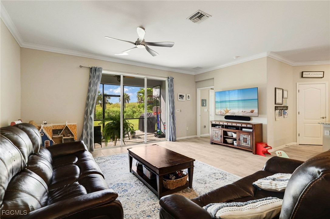 9778 Mirada Boulevard Fort Myers, FL 33908 - Photo 14 of 29 a living room with furniture and a flat screen tv
