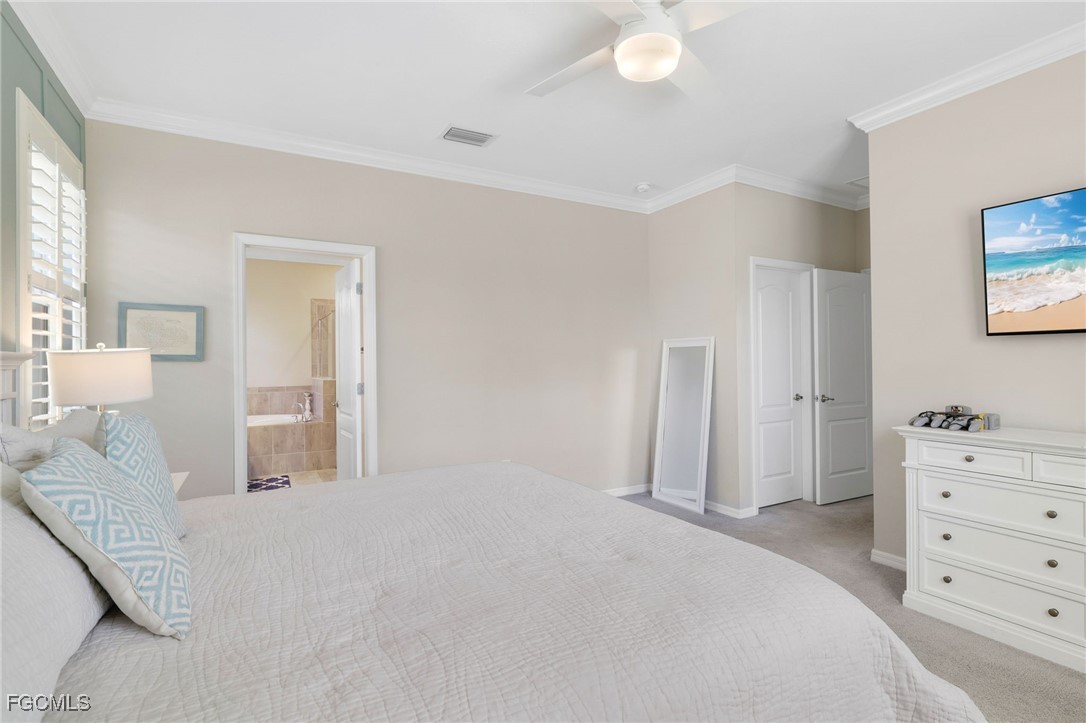 9778 Mirada Boulevard Fort Myers, FL 33908 - Photo 17 of 29 a bedroom with a bed and a cabinets