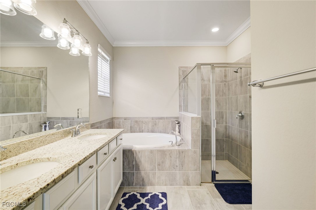 9778 Mirada Boulevard Fort Myers, FL 33908 - Photo 18 of 29 a bathroom with a double vanity sink mirror and shower