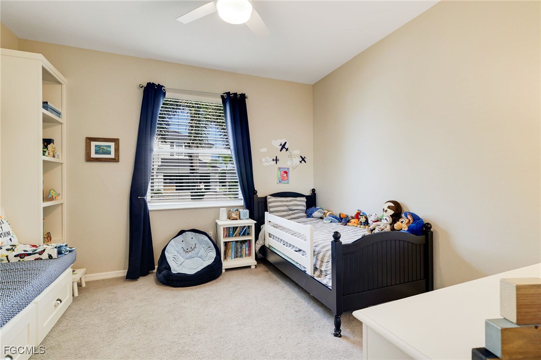 9778 Mirada Boulevard Fort Myers, FL 33908 - Photo 22 of 29 a bed room with a bed and a couch