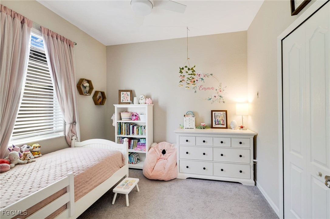 9778 Mirada Boulevard Fort Myers, FL 33908 - Photo 25 of 29 a bedroom with a bed and a window