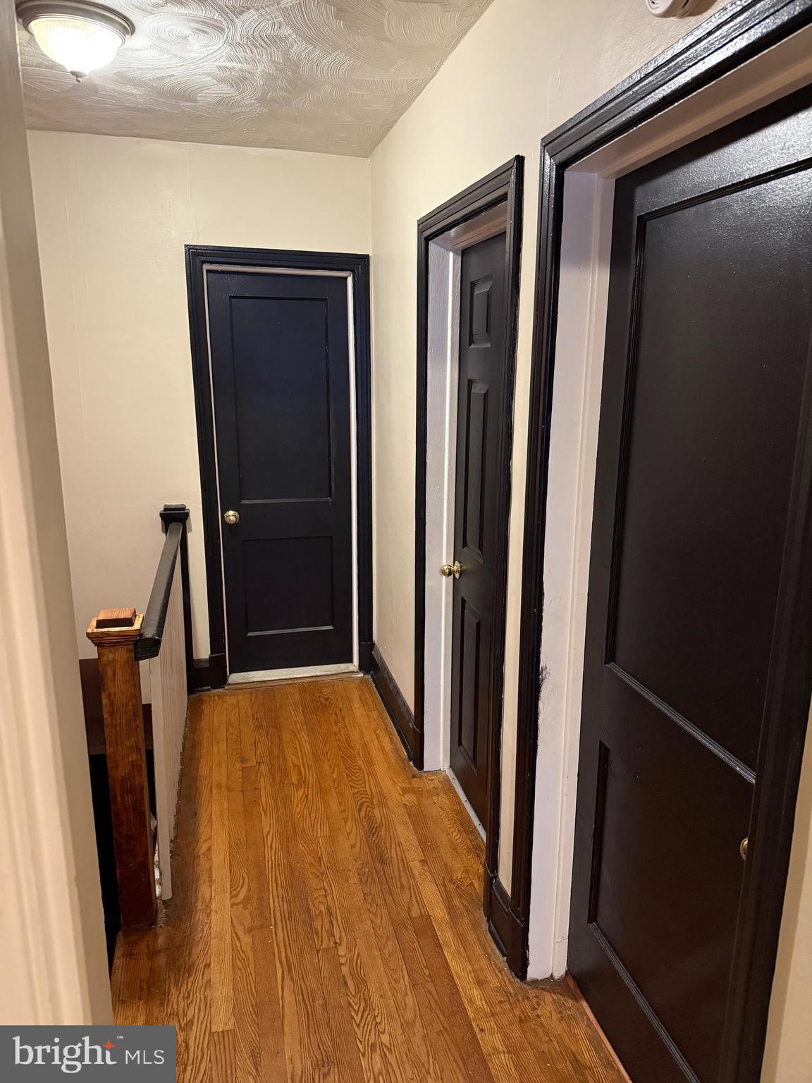 703 North Augusta Avenue Baltimore, MD 21229 - Photo 9 of 14 a view of front door with wooden floor