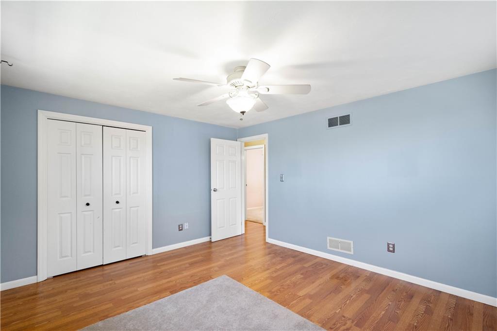 169 Balver Avenue Pittsburgh, PA 15205 - Photo 12 of 24 a view of an empty room with chandelier fan and wooden floor