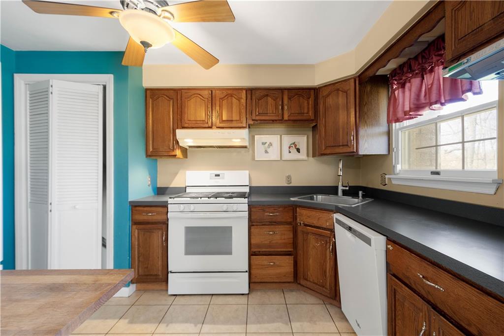 169 Balver Avenue Pittsburgh, PA 15205 - Photo 6 of 24 a kitchen with a stove cabinets and a sink