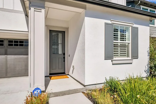 a view of front door of house with window