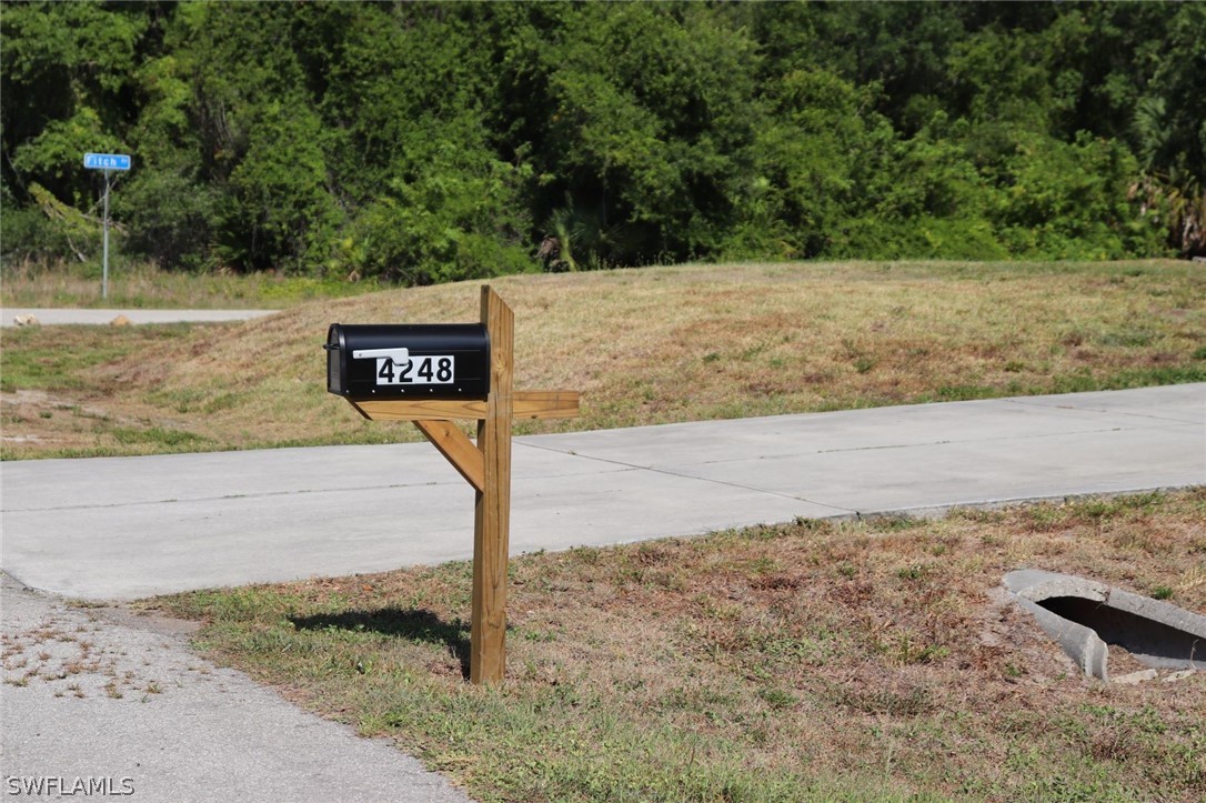 4244 East 24th Street Alva, FL 33920 - Photo 4 of 13 a sign that is on the side of a road